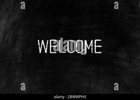 Welcome on Black Chalkboard Background, Suitable for Business Concept.