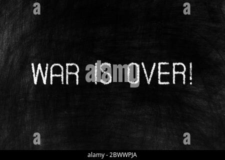 War is Over on Grunge Chalkboard Background. Stock Photo