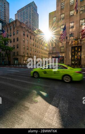 The sun sets in to among the high-rise Rockefeller Center buildings during the Quarantine for COVID-19 at New York NY USA on Memorial Day May 25 2020. Stock Photo