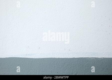 White and Gray Painting on Concrete Wall Texture Background. Stock Photo