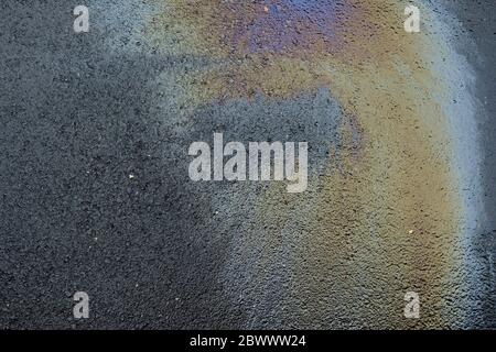 Oil Spill on Asphalt Road Background. Stock Photo