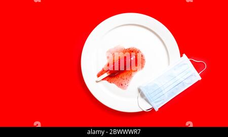 Delicious defrosted strawberry popsicles and medical mask over red background Stock Photo