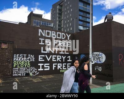 Glasgow, UK, 3rd June 2020. Memorial to George Floyd, the African-American man killed in Minneapolis, Minnesota, USA, by officers of the Minneapolis Police Department, written on a wall beside the River Clyde, in Glasgow, Scotland, on 3 June 2020. Photo credit: Jeremy Sutton-Hibbert/Alamy Live News. Stock Photo