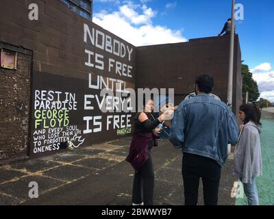 Glasgow, UK, 3rd June 2020. Memorial to George Floyd, the African-American man killed in Minneapolis, Minnesota, USA, by officers of the Minneapolis Police Department, written on a wall beside the River Clyde, in Glasgow, Scotland, on 3 June 2020. Photo credit: Jeremy Sutton-Hibbert/Alamy Live News. Stock Photo