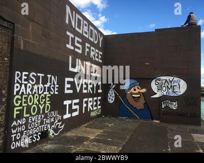 Glasgow, UK, 3rd June 2020. Memorial to George Floyd, the African-American man killed in Minneapolis, Minnesota, USA, by officers of the Minneapolis Police Department, written on a wall beside the River Clyde, in Glasgow, Scotland, on 3 June 2020. Photo credit: Jeremy Sutton-Hibbert/Alamy Live News. Stock Photo