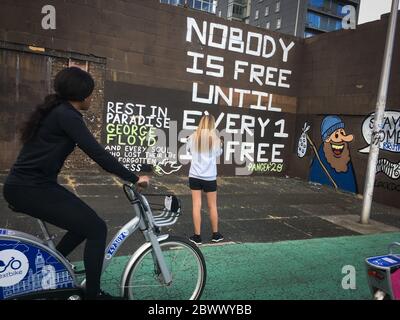 Glasgow, UK, 3rd June 2020. Memorial to George Floyd, the African-American man killed in Minneapolis, Minnesota, USA, by officers of the Minneapolis Police Department, written on a wall beside the River Clyde, in Glasgow, Scotland, on 3 June 2020. Photo credit: Jeremy Sutton-Hibbert/Alamy Live News. Stock Photo