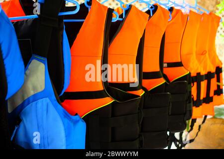 Close up Life Jackets and Life Vests for Boat Trips. Stock Photo