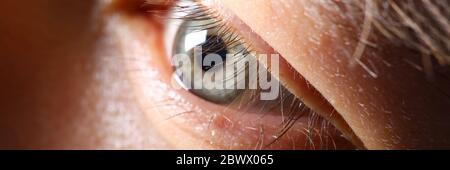 Male eyelashes extreme close-up in low light Stock Photo