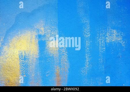 Golden Stain on Blue Painting Concrete Wall Texture Background. Stock Photo