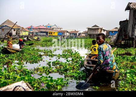 Africa, West Africa, Benin, Lake Nokoue, Ganvié. Pirogues in the water streets of the lakeside town of Ganvié. Stock Photo