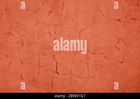 Coral Color Painting on Broken Concrete Wall Texture Background. Stock Photo