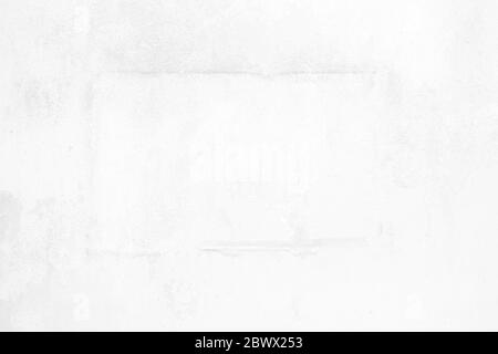 Old Peeling Poster on White Concrete Wall Texture Background. Stock Photo