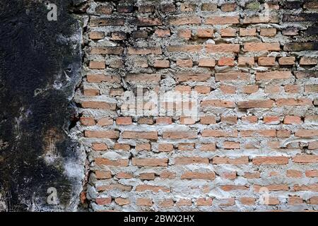 Reconstructed Old Concrete Wall Background with New Bricks Stock Photo