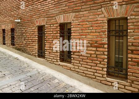 Row of beautiful windows on the old brick wall Stock Photo