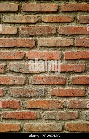 Vertical image of the weathered brick wall in the old city Stock Photo