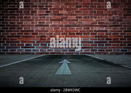 White Arrow on the Road Straight to the Old Brick Wall Background, Suitable for Business Dead End Concept. Stock Photo