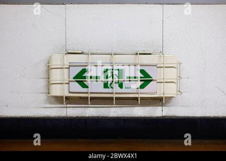 Emergency Exit Sign on Wall. Stock Photo