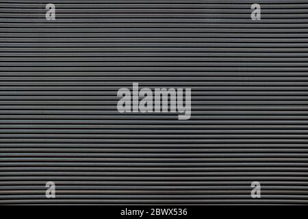 Old Black Striped Metal Wall Texture Background. Stock Photo