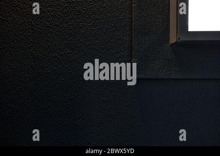 Light Beam from the Window on Dark Concrete Wall Texture Background, Suitable for Minimal Concept. Stock Photo