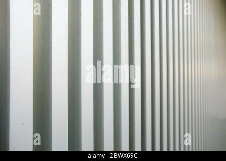 White Vertical Stripes Concrete Wall Texture Background. Stock Photo