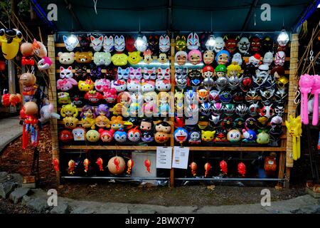 SAPPORO, JAPAN - NOVEMBER 09, 2019: Colorful mask shop in front of Hokkaido shrine Mikado where is a tourist attraction in Sapporo, Japan. Stock Photo