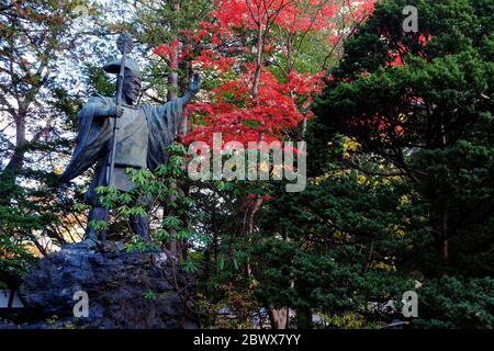 SAPPORO, JAPAN - NOVEMBER 09, 2019: Yoshitake Shima Ancient Bronze Statue in front of Hokkaido Shrine Mikado where is a Tourist Attraction in Sapporo, Stock Photo