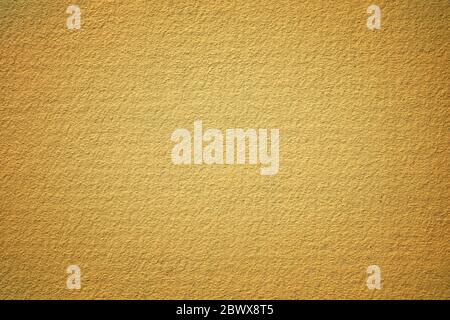 Yellow Painting on Stucco Wall Background. Stock Photo