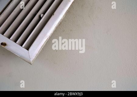 Broken Air Outlet on Old Concrete Wall Texture Background. Stock Photo