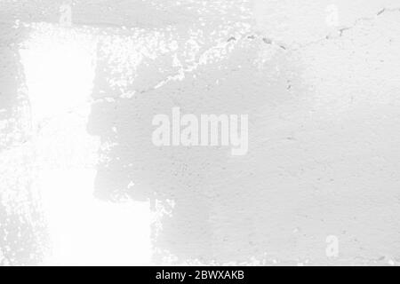 White Painting on Broken Concrete Wall Texture Background. Stock Photo