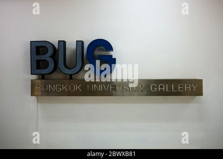 BANGKOK, THAILAND - FEBRUARY 25, 2020: BUG gallery sign on white concrete wall. BUG is the art museum in Bangkok university where is a famous private Stock Photo