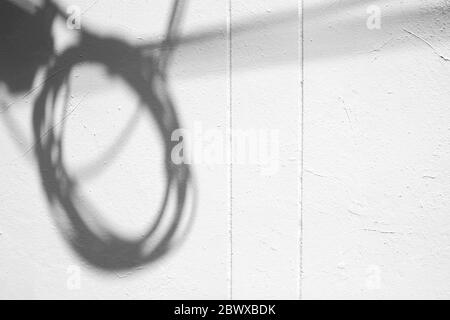 Electric Wire Shadow on White Concrete Wall Texture Background. Stock Photo