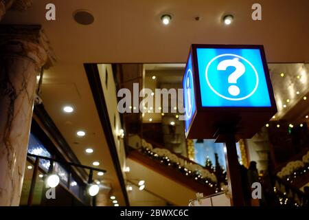 Information Sign and Help Desk at Hallway of Mall. Stock Photo