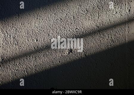 Sunlight Beam with Shadow on Grunge Concrete Wall Texture Background. Stock Photo