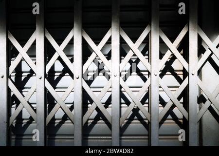 Foldable Metal Door with Shadow Background. Stock Photo