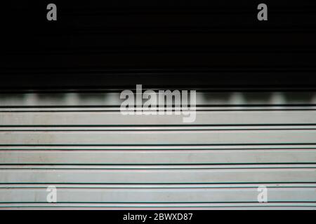 Roof Shadow on Foldable Metal Door Background. Stock Photo
