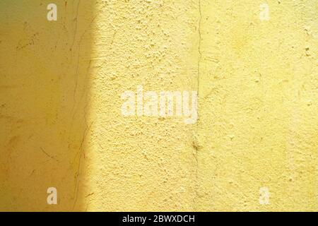 Sun Light Beam on Grunge Yellow Paint Concrete Wall Background. Stock Photo