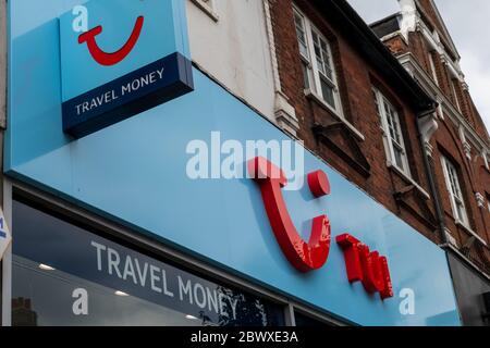 Shop signs and logo of the travel agent TUI, previously know as Thompson. TUI Group is on of the world's biggest travel and holiday company. Stock Photo