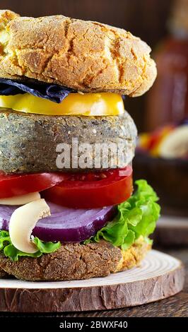 gourmet, healthy burger made with organic products. Vegan food, with fresh vegetables and proteins. Stock Photo