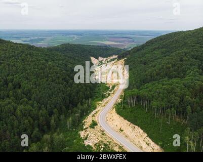 Aerial top vew of winding road in the mountains Stock Photo