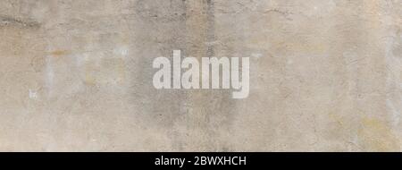 Wide panoramic background of concrete wall, grunge shades of tan and gray, creative copy space, horizontal aspect Stock Photo