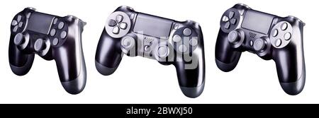 Set of black video game joysticks gamepad isolated on a black ...