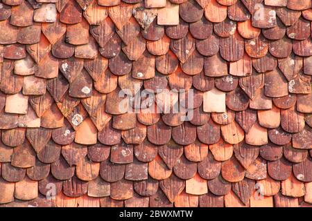 Old terracotta tiles on roof texture background Stock Photo
