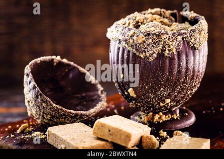 homemade easter egg, easter from brazil. Chocolate with paçoca, Brazilian ingredient made from ground peanuts. Stock Photo