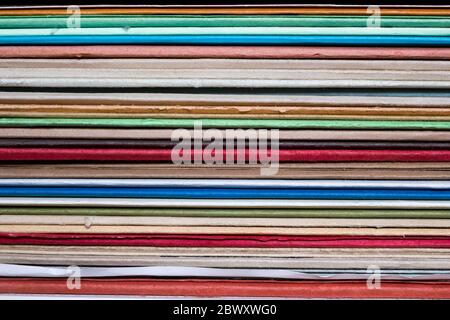 Stack of colorful folders. Rough paper. Intricate texture. Perfect order. Stock Photo