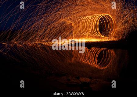 Long exposure and steel wool in the rockery on the beach of Balikliova Stock Photo