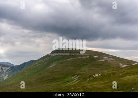 Transalpina road in Romania viewed from a large distance - the highest road in Romania and the carpathians mountains Stock Photo