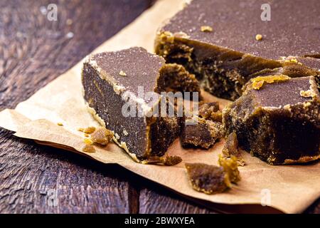 Sweet made from sugar cane, on a rustic wooden table, delicacy from Latin America, homemade desserts, Stock Photo