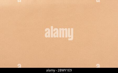 Beige leather texture background. Beige faux leather background. Close up. Copy space. Stock Photo