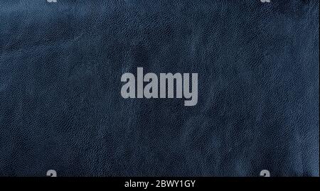 Dark blue leather texture background. Dark blue artificial leather background. Close up. Copy space. Stock Photo
