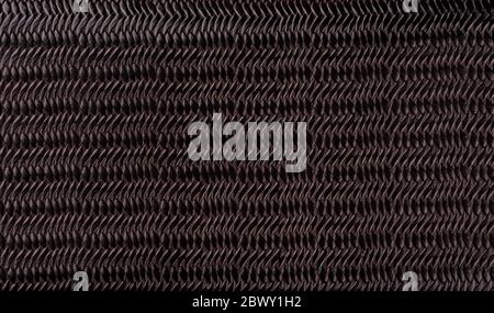 Brown synthetic leather with embossed background texture. Brown artificial leather background. Close up. Copy space. Stock Photo